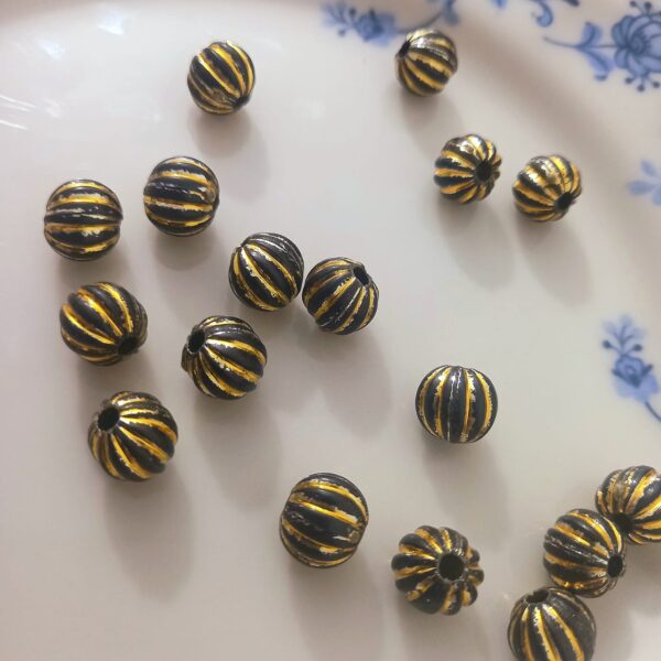 Round Beads With Golden Lines