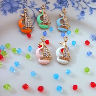 Ship charms with enamel coating
